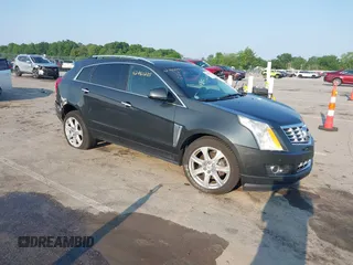 2014 Cadillac SRX Performance Collection with VIN 3GYFNFE35ES663320, listed as a IAAI auction lot 42480235 with 112,406 mi miles and . Bid and sale history available at DreamBid. Image 1.