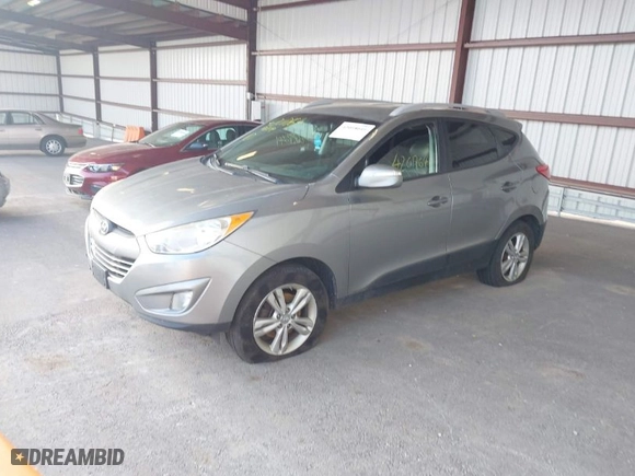 2013 Hyundai Tucson GLS with VIN KM8JU3AC6DU769194, listed as a IAAI auction lot 42018641 with 169,537 mi miles. Bid and sale history available at carsss.com. Image 2.
