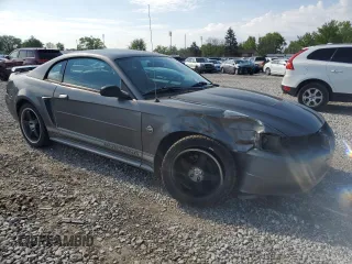 2004 Ford Mustang Standard with VIN 1FAFP40674F229138, listed as a Copart auction lot 56186445 with 128,566 mi miles and Salvage title. Bid and sale history available at DreamBid. Image 4.