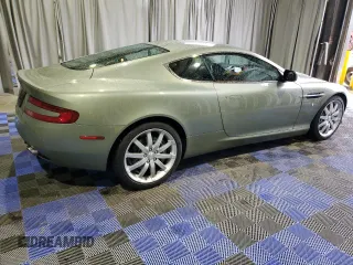 2005 Aston Martin DB9 z VIN SCFAD01A25GA00018, wystawiony jako Copart lot #84703534 z przebiegiem 19 831 mil mil oraz Tytuł czysty. Historia ofert i sprzedaży dostępna na DreamBid. Obrazek 3.