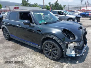 2015 MINI Hardtop 4 Door S z VIN WMWXU3C58F2B66601, wystawiony jako IAAI lot #42444404 z przebiegiem 76 174 mil mil oraz . Historia ofert i sprzedaży dostępna na DreamBid. Obrazek 1.