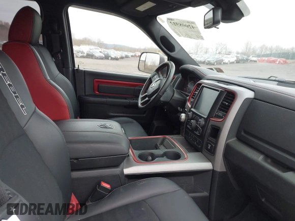 2016 Ram 1500 Rebel z VIN 1C6RR7YT3GS307866, wystawiony jako IAAI lot #42008912 z przebiegiem 65 556 mil mil oraz . Historia ofert i sprzedaży dostępna na DreamBid. Obrazek 5.