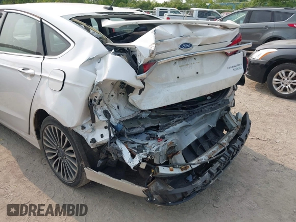 2017 Ford Fusion Titanium z VIN 3FA6P0K92HR396113, wystawiony jako IAAI lot #42402969 z przebiegiem 185 620 mil mil oraz . Historia ofert i sprzedaży dostępna na DreamBid. Obrazek 6.