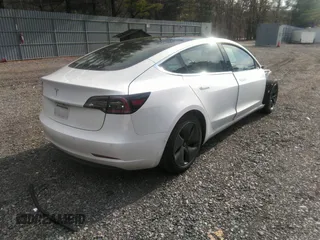 2020 Tesla Model 3 Standard Range Plus with VIN 5YJ3E1EA4LF792830, listed as a IAAI auction lot 41852919 with 76,461 mi miles. Bid and sale history available at carsss.com. Image 4.
