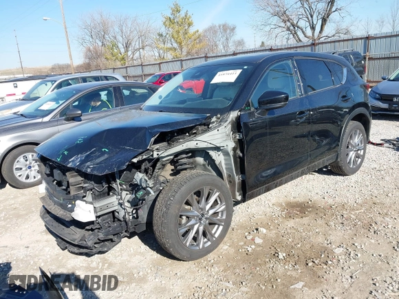 2021 Mazda CX-5 Grand Touring with VIN JM3KFBDM0M0468081, listed as a IAAI auction lot 41894411 with 54,664 mi miles. Bid and sale history available at carsss.com. Image 2.