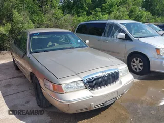 2000 Mercury Grand Marquis GS z VIN 2MEFM74W2YX641264, wystawiony jako IAAI lot #42175831 z przebiegiem 156 165 mil mil oraz . Historia ofert i sprzedaży dostępna na DreamBid. Obrazek 1.