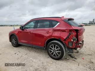 2018 Mazda CX-5 Grand Touring with VIN JM3KFADM8J0451535, listed as a Copart auction lot 59990435 with 77,163 mi miles and Salvage title. Bid and sale history available at DreamBid. Image 2.