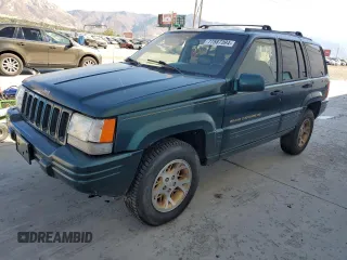 1998 Jeep Grand Cherokee Limited with VIN 1J4GZ78Y1WC124156, listed as a Copart auction lot 77587394 with 176,936 mi miles and Clean Title. Bid and sale history available at carsss.com. Image 1.
