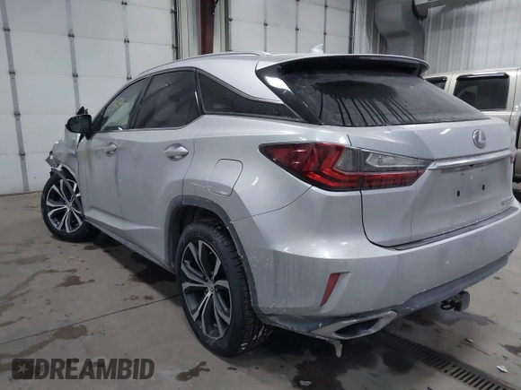2017 Lexus RX with VIN 2T2BZMCAXHC067275, listed as a IAAI auction lot 41386504 with 100,477 mi miles. Bid and sale history available at carsss.com. Image 3.