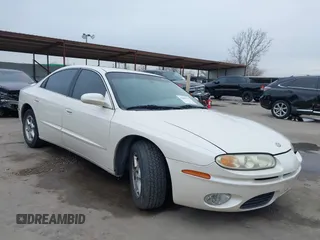 2002 Oldsmobile Aurora z VIN 1G3GR64H124127052, wystawiony jako IAAI lot #41646711 z przebiegiem 198 141 mil mil oraz . Historia ofert i sprzedaży dostępna na DreamBid. Obrazek 1.