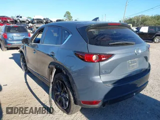 2021 Mazda CX-5 Touring with VIN JM3KFACM1M0371354, listed as a IAAI auction lot 40938490 with 56,172 mi miles. Bid and sale history available at carsss.com. Image 3.