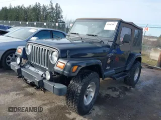 1999 Jeep Wrangler Sahara with VIN 1J4FY49S9XP410760, listed as a IAAI auction lot 41647187 with 181,353 mi miles. Bid and sale history available at carsss.com. Image 2.