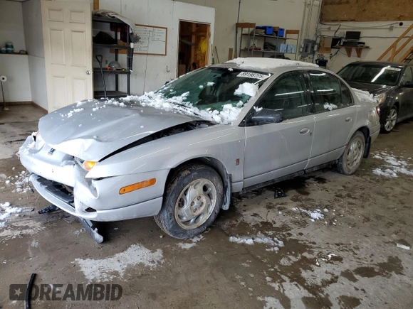 2001 Saturn SL with VIN 1G8ZK54791Z298951, listed as a Copart auction lot 89198795 with 157,208 mi miles and Salvage title. Bid and sale history available at DreamBid. Image 1.