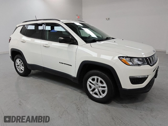 2018 Jeep Compass Sport z VIN 3C4NJDAB1JT306171, wystawiony jako Copart lot #55169745 z przebiegiem 54 489 mil mil oraz Czysty tytuł • Clean title. Historia ofert i sprzedaży dostępna na DreamBid. Obrazek 4.