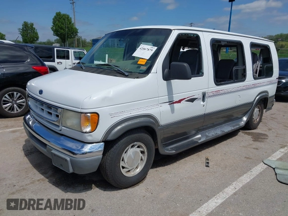 1999 Ford Econoline Cargo Recreational with VIN 1FDRE14L2XHA41059, listed as a IAAI auction lot 42067879 with 149,185 mi miles. Bid and sale history available at carsss.com. Image 22.