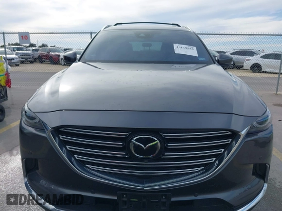 2023 Mazda CX-9 Grand Touring z VIN JM3TCBDY0P0631395, wystawiony jako IAAI lot #41449555 z przebiegiem 17 721 mil mil oraz . Historia ofert i sprzedaży dostępna na DreamBid. Obrazek 12.