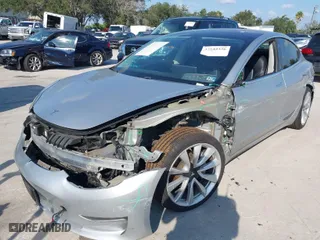 2018 Tesla Model 3 Long Range Battery with VIN 5YJ3E1EA3JF032076, listed as a IAAI auction lot 41523120 with 144667 miles. Bid and sale history available at carsss.com. Image 6.
