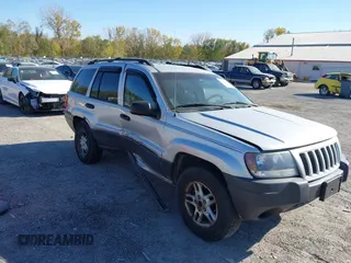 2004 Jeep Grand Cherokee Laredo with VIN 1J4GW48S04C269088, listed as a IAAI auction lot 40640335 with 130,288 mi miles and . Bid and sale history available at DreamBid. Image 1.