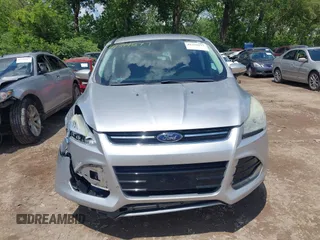 2013 Ford Escape SEL z VIN 1FMCU9H94DUD19842, wystawiony jako IAAI lot #42399577 z przebiegiem 176 257 mil mil oraz . Historia ofert i sprzedaży dostępna na DreamBid. Obrazek 13.