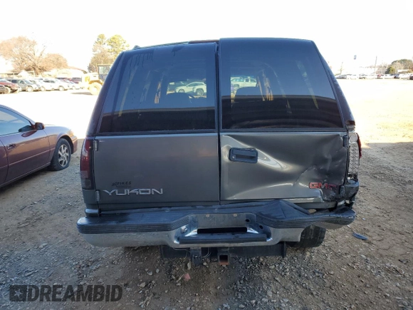 1999 GMC Yukon with VIN 1GKEK13R3XJ750307, listed as a Copart auction lot 84728104 with 212,879 mi miles and Salvage Title. Bid and sale history available at carsss.com. Image 6.
