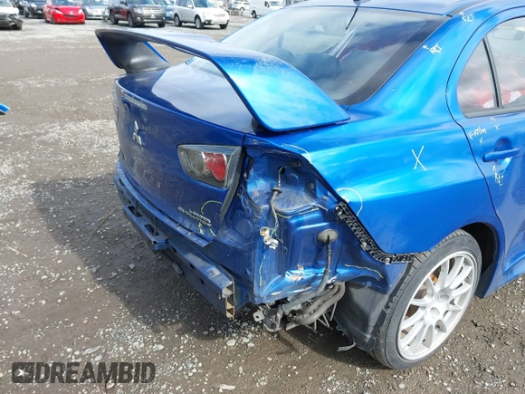 2015 Mitsubishi Lancer Evolution GSR with VIN JA32W8FV4FU012578, listed as a IAAI auction lot 41730742 with 64,762 mi miles. Bid and sale history available at carsss.com. Image 6.