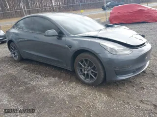 2023 Tesla Model 3 with VIN 5YJ3E1EAXPF693693, listed as a IAAI auction lot 41709704 with 12,473 mi miles. Bid and sale history available at carsss.com. Image 1.