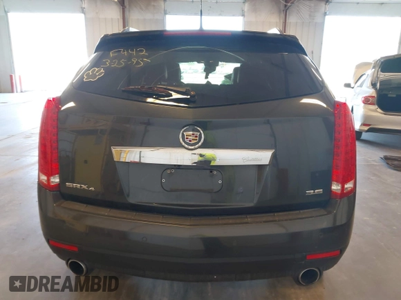 2014 Cadillac SRX Premium Collection z VIN 3GYFNGE38ES606731, wystawiony jako IAAI lot #41844450 z przebiegiem 156 541 mil mil oraz . Historia ofert i sprzedaży dostępna na DreamBid. Obrazek 16.