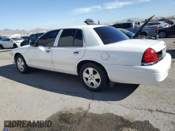 2011 Ford Crown Victoria LX z VIN 2FABP7EV1BX147343, wystawiony jako Copart lot #84844144 z przebiegiem 139 638 mil mil oraz Czysty tytuł • Clean title. Historia ofert i sprzedaży dostępna na DreamBid. Obrazek 2.