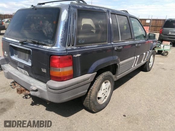 1994 Jeep Grand Cherokee Laredo with VIN 1J4GZ58Y3RC202638, listed as a IAAI auction lot 41885484 with 164,481 mi miles. Bid and sale history available at carsss.com. Image 4.