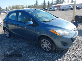 2014 Mazda 2 Sport with VIN JM1DE1KZ1E0188877, listed as a IAAI auction lot 42013393 with 59,083 mi miles. Bid and sale history available at carsss.com. Image 1.