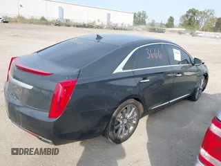 2013 Cadillac XTS Luxury with VIN 2G61P5S3XD9228218, listed as a IAAI auction lot 40503666 with 87,857 mi miles. Bid and sale history available at carsss.com. Image 4.