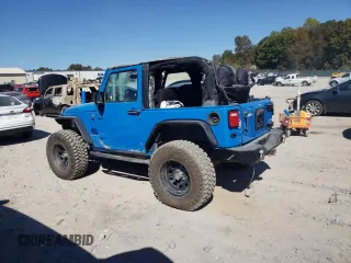 2011 Jeep Wrangler Rubicon with VIN 1J4BA6D15BL563410, listed as a Copart auction lot 76973964 with 68,334 mi miles and Salvage title. Bid and sale history available at DreamBid. Image 2.