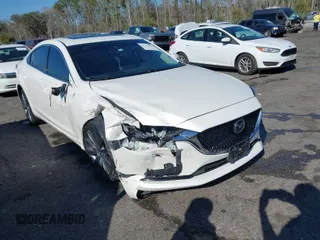 2021 Mazda Mazda6 Touring with VIN JM1GL1VM9M1600670, listed as a IAAI auction lot 41757003 with 37,131 mi miles. Bid and sale history available at carsss.com. Image 1.