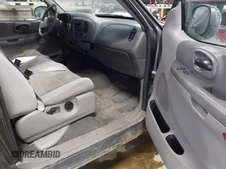 2003 Ford F-150 XL with VIN 1FTRX18W63NB69173, listed as a IAAI auction lot 41618645 with 219,506 mi miles. Bid and sale history available at carsss.com. Image 5.