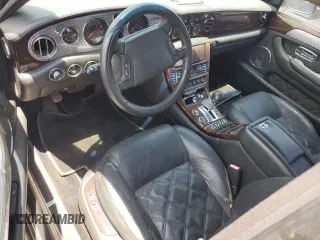 2003 Bentley Arnage z VIN SCBLF34F53CX09475, wystawiony jako Copart lot #57302795 z przebiegiem Nie podano mil oraz Czysty tytuł • Clean title. Historia ofert i sprzedaży dostępna na DreamBid. Obrazek 8.