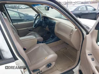 1999 Ford Explorer XLT z VIN 1FMZU32E4XZA40685, wystawiony jako IAAI lot #41531759 z przebiegiem 200 419 mil mil oraz . Historia ofert i sprzedaży dostępna na DreamBid. Obrazek 5.