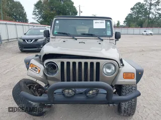 2003 Jeep Wrangler SE with VIN 1J4FA29113P304250, listed as a IAAI auction lot 40917099 with 191,589 mi miles. Bid and sale history available at carsss.com. Image 12.