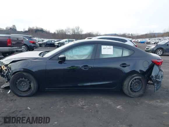 2015 Mazda 3 i SV with VIN JM1BM1T79F1237259, listed as a IAAI auction lot 40971092 with 140,871 mi miles. Bid and sale history available at carsss.com. Image 14.