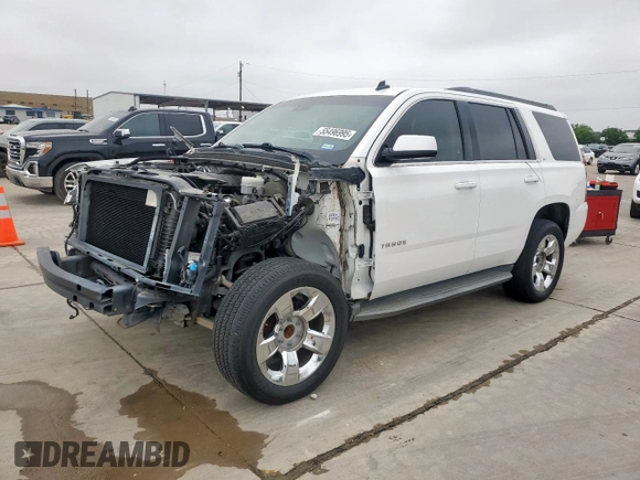 2015 Chevrolet Tahoe LT with VIN 1GNSCBKC0FR210211, listed as a Copart auction lot 55496995 with 128,296 mi miles and Salvage title. Bid and sale history available at DreamBid. Image 1.