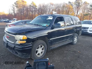 2004 GMC Yukon Denali z VIN 1GKEK63UX4J280662, wystawiony jako IAAI lot #40847473 z przebiegiem 95 677 mil mil oraz . Historia ofert i sprzedaży dostępna na DreamBid. Obrazek 2.