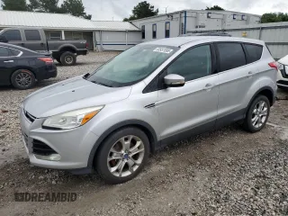 2013 Ford Escape SEL z VIN 1FMCU9HX1DUA60189, wystawiony jako Copart lot #60937895 z przebiegiem 159 057 mil mil oraz Czysty tytuł • Clean title. Historia ofert i sprzedaży dostępna na DreamBid. Obrazek 1.