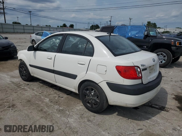 2009 Kia Rio LX with VIN KNADE223996526222, listed as a Copart auction lot 69976484 with 318,702 mi miles and Salvage Title. Bid and sale history available at DreamBid. Image 2.