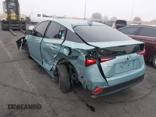 2022 Toyota Prius L Eco with VIN JTDKAMFU9N3186859, listed as a IAAI auction lot 41486941 with 122,665 mi miles and . Bid and sale history available at DreamBid. Image 3.