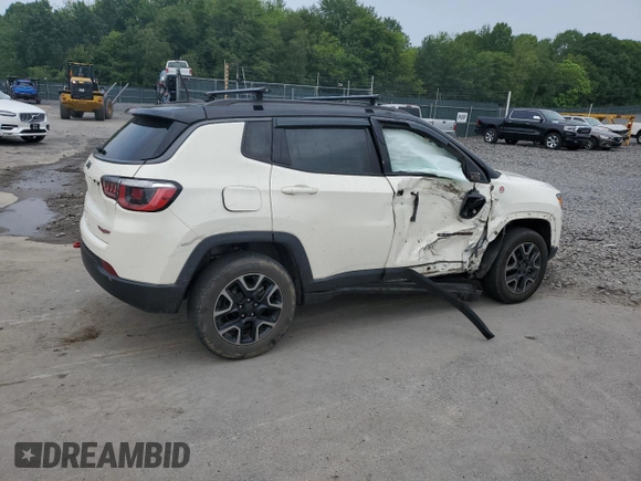 2019 Jeep Compass Trailhawk with VIN 3C4NJDDB5KT671613, listed as a Copart auction lot 61023125 with 64,793 mi miles and Salvage title. Bid and sale history available at DreamBid. Image 3.