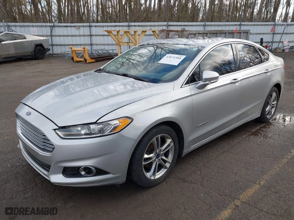 2015 Ford Fusion Titanium Hybrid with VIN 3FA6P0RU8FR181312, listed as a IAAI auction lot 42071584 with 99,955 mi miles. Bid and sale history available at carsss.com. Image 2.