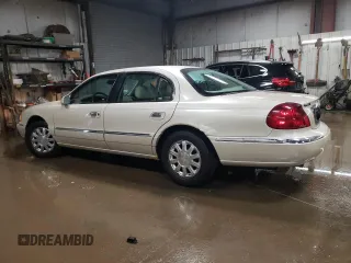 2000 Lincoln Continental with VIN 1LNHM97V2YY760288, listed as a Copart auction lot 80894624 with 115,785 mi miles and Salvage Title. Bid and sale history available at carsss.com. Image 2.