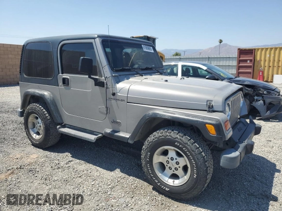 2000 Jeep Wrangler SE with VIN 1J4FA29P7YP737289, listed as a Copart auction lot 61869865 with 91,097 mi miles and Salvage title. Bid and sale history available at DreamBid. Image 4.