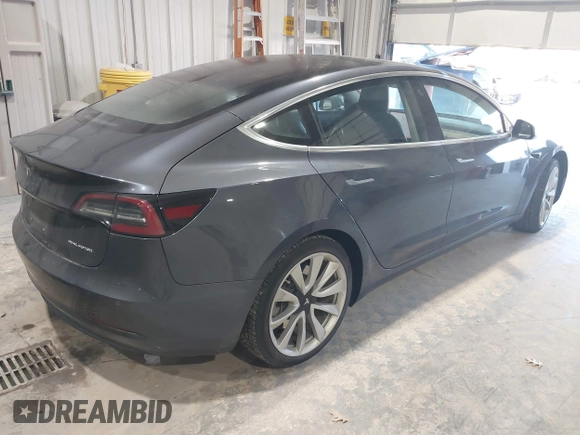 2018 Tesla Model 3 Long Range Battery with VIN 5YJ3E1EB1JF145520, listed as a IAAI auction lot 41360939 with 95,010 mi miles and . Bid and sale history available at DreamBid. Image 4.