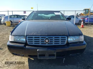 2001 Cadillac Eldorado Touring ETC z VIN 1G6ET12961B100627, wystawiony jako IAAI lot #41458966 z przebiegiem 113 620 mil mil oraz . Historia ofert i sprzedaży dostępna na DreamBid. Obrazek 6.