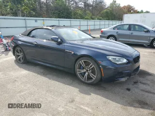 2015 BMW M6 z VIN WBSLZ9C59FD651474, wystawiony jako Copart lot #60882454 z przebiegiem Nie podano mil oraz Szkody całkowita. Historia ofert i sprzedaży dostępna na DreamBid. Obrazek 4.